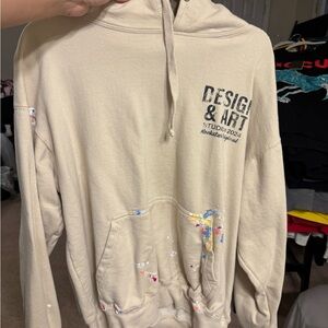 Cream Hoodie with Artistic Design